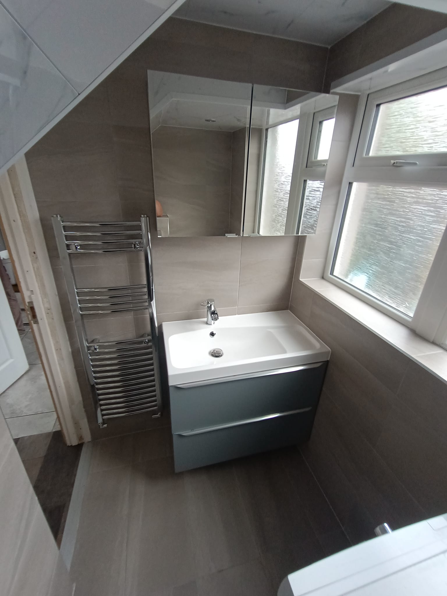 Beige bathroom with blue grey vanity