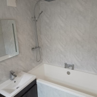 Marble tiled walls in a bathroom