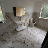 marble bathroom with gold accents