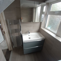 Beige bathroom with blue grey vanity