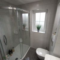 large curved shower in a bathroom