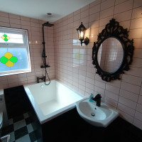 Pink and black bathroom